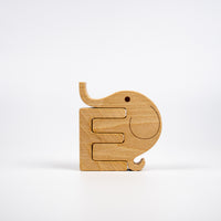 Wooden elephant puzzle on a white background