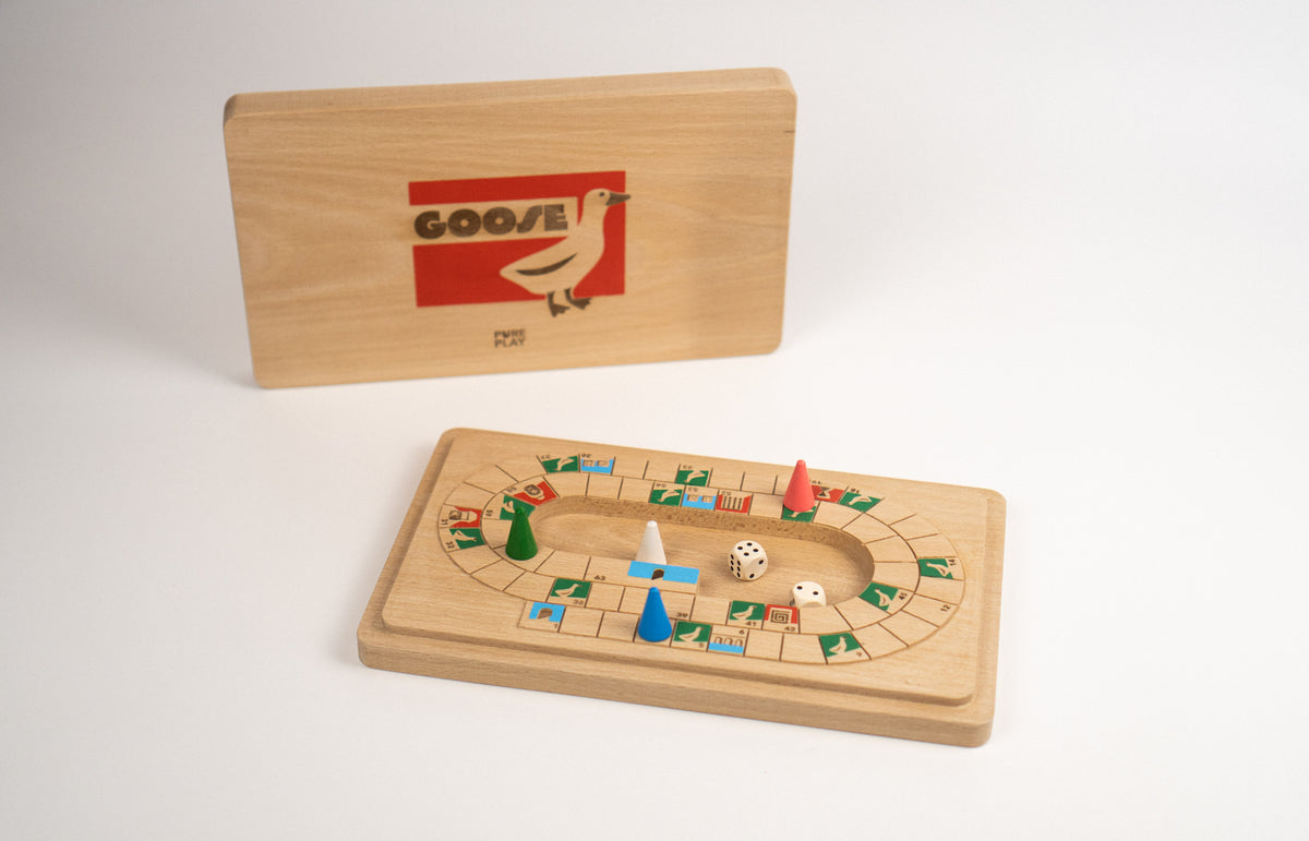 Wooden board game with pieces and a dice on a white background