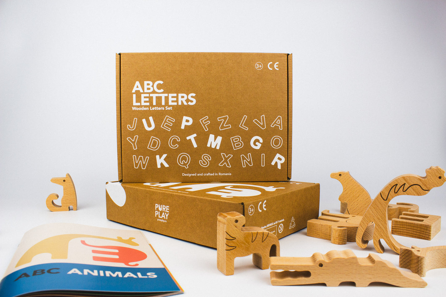 Cardboard box. Montessori Wooden Alphabet Puzzle Set with Animal Figurines. Made in Romania.